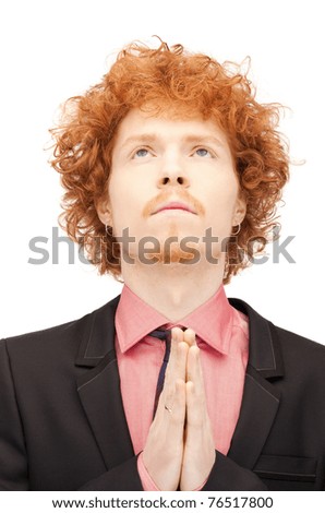 bright closeup portrait picture of praying businessman