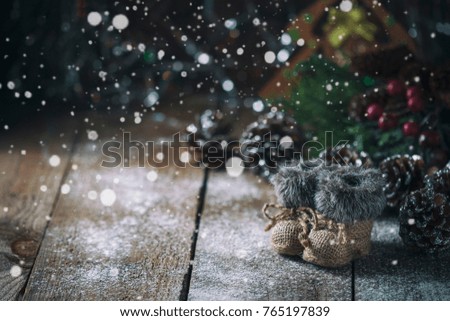 Christmas background with decorations on a Christmas tree handmade, winter boots. Soft focus. Festive still life