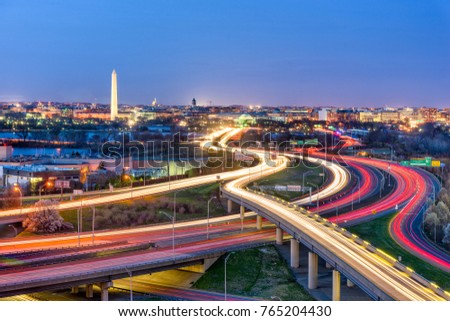 Washington, D.C. skyline with highways and monuments.