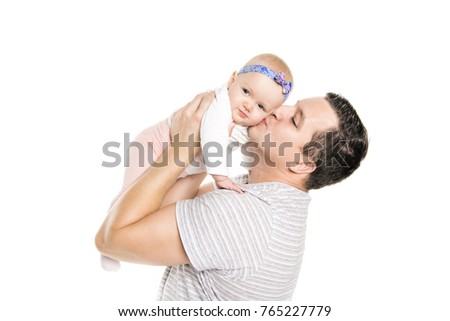A Young dad is enjoying time with his child girl in studio white background