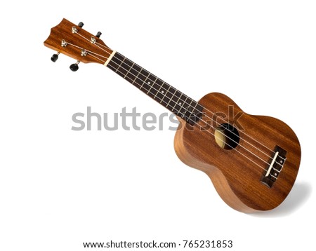 The brown ukulele on the white background Royalty-Free Stock Photo #765231853