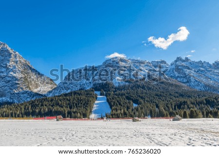 Ski resort on a sunny winter afternoon, Italy.