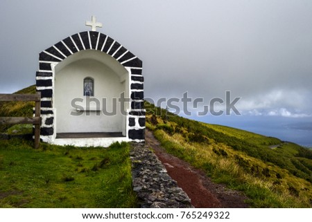 stone chapel on top of a volcano on the island of faia on the azores