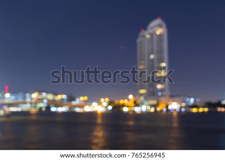 Blur light of high building at the river for background