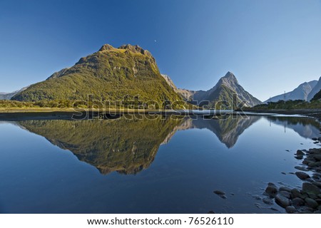 mountain reflection on the water at Milford Sound, New zealand, south island
