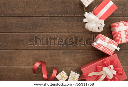 gift boxes of present for new year, christmas, birthday or anniversary on wood background. above view