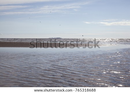 The Gulf of Finland in the bright warm July afternoon in the town of Sestroretsk