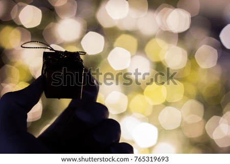 Silhouette gift box on bokeh background
