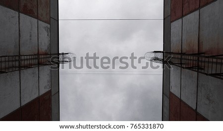 Sky between the houses. Sky background. Sky and buildings. Grunge background.