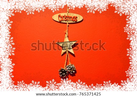 Christmas decoration on red background with snowflakes as frame
