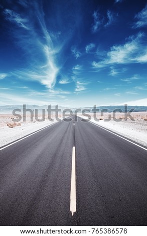 Death Valley desert road, travel concept, color toned picture, USA. Royalty-Free Stock Photo #765386578