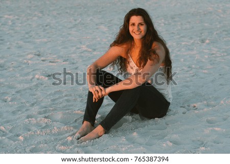 Young Female Model Sitting on the Beach