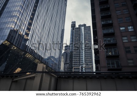 Chicago skyscrapers and el track with cloudy sky