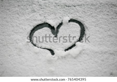 Drawn heart in the snow