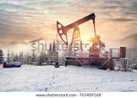 Day and night, in a severe frost and a snowstorm, a snowstorm in winter in Ukraine electric mountain pumps oil pump oil gas is a valuable raw material for energy 
 chemical industry
