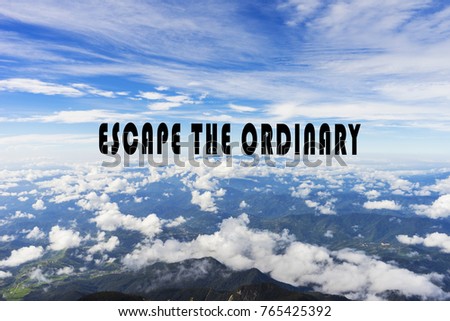 Inspirational quote-escape the ordinary with a background of a mountain range and blue sky.