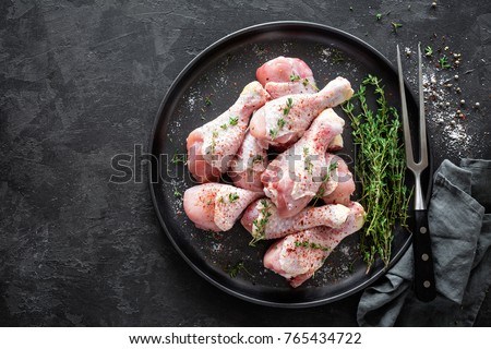 Raw marinated chicken meat, chicken legs Royalty-Free Stock Photo #765434722