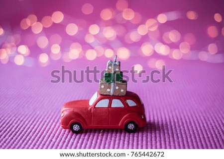 Christmas toy  car on pink background 