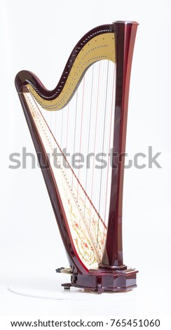Classical music instrument. Pedal harp Royalty-Free Stock Photo #765451060