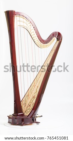 Classical music instrument. Pedal harp Royalty-Free Stock Photo #765451081