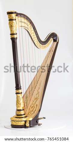 Classical music instrument. Pedal harp Royalty-Free Stock Photo #765451084