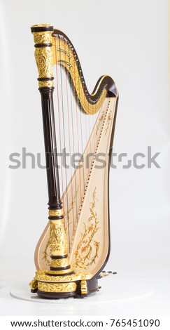 Classical music instrument. Pedal harp Royalty-Free Stock Photo #765451090
