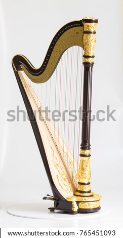 Classical music instrument. Pedal harp Royalty-Free Stock Photo #765451093