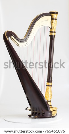 Classical music instrument. Pedal harp Royalty-Free Stock Photo #765451096