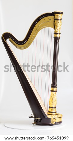 Classical music instrument. Pedal harp Royalty-Free Stock Photo #765451099