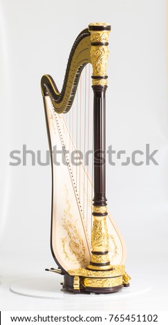 Classical music instrument. Pedal harp Royalty-Free Stock Photo #765451102