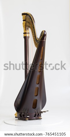 Classical music instrument. Pedal harp Royalty-Free Stock Photo #765451105