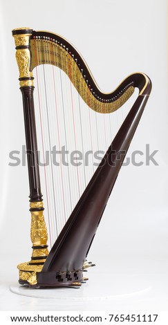 Classical music instrument. Pedal harp Royalty-Free Stock Photo #765451117