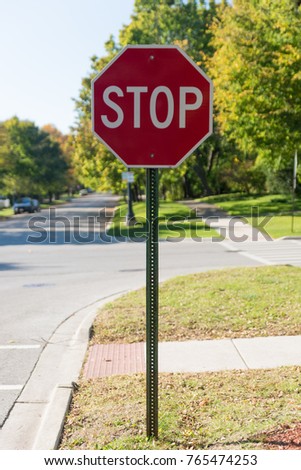 Red stop sign on the suburban street