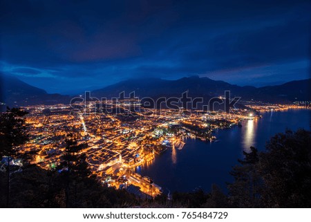 View of the beautiful Lake Garda .Riva del Garda town and Garda lake by night, Italy