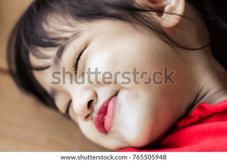 Portrait of cute Little asian girl in moment of happiness. Children sleeping and be smile.
