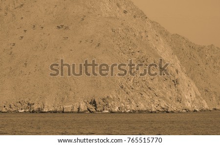 Ancient view of the Gulf of Oman, the lair of pirates from prehistoric times. Artistic view. Old style photo. 
