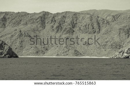 Pirate's lair in the Gulf of Oman. Medieval view.  Old style photo