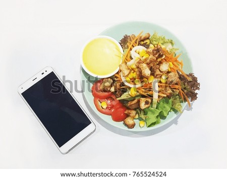 Salad Vegetables and Pork with smartphone