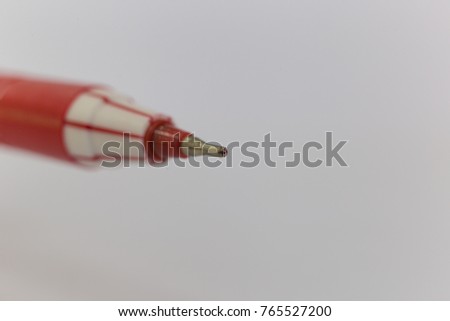 Closeup picture of a red pen