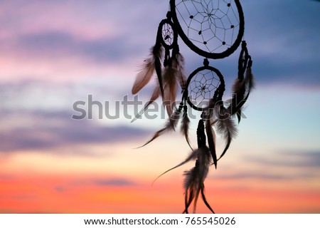 Dream Catcher on the sunset background Royalty-Free Stock Photo #765545026