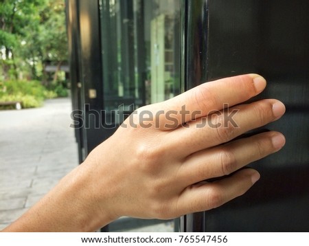 People hand open the door with nature reflection background