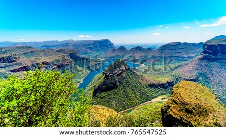 View of the highveld and the Blyde River Dam in the Blyde River Canyon Reserve, along the Panorama Route in Mpumalanga Province of South Africa Royalty-Free Stock Photo #765547525