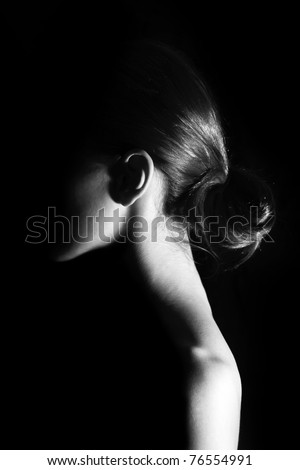 Girl at black background. Photo in black and white style.