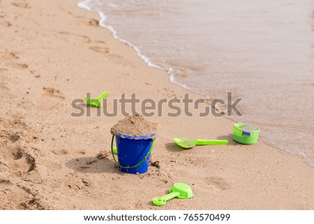 baby pail on the sand by the sea