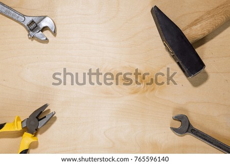 Hammer, pliers, screwdriver, wrench, screws. Home repair tools. DIY set. Wooden texture