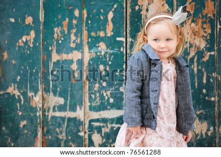 Portrait of very cute little princess outdoors