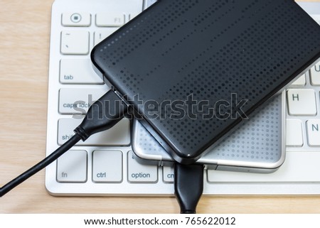 External hard disk on laptop. 
External hard drive on keyboard. 
