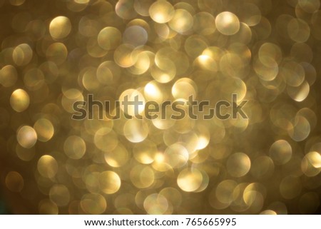 Bokeh of golden ball with sparkling light shining background