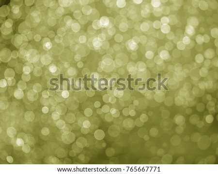 Blurred light or Bokeh of water fly and lights on yellow background