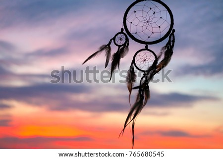 Dream catcher sky background at sunset Royalty-Free Stock Photo #765680545